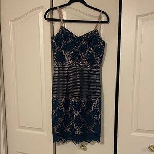 Elegant Lace Overlay Dress in Navy and Nude
Size small- dress the population.